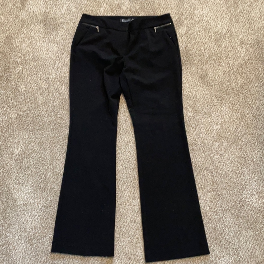Black women’s dress slacks. Polyester, rayon , and spandex.
